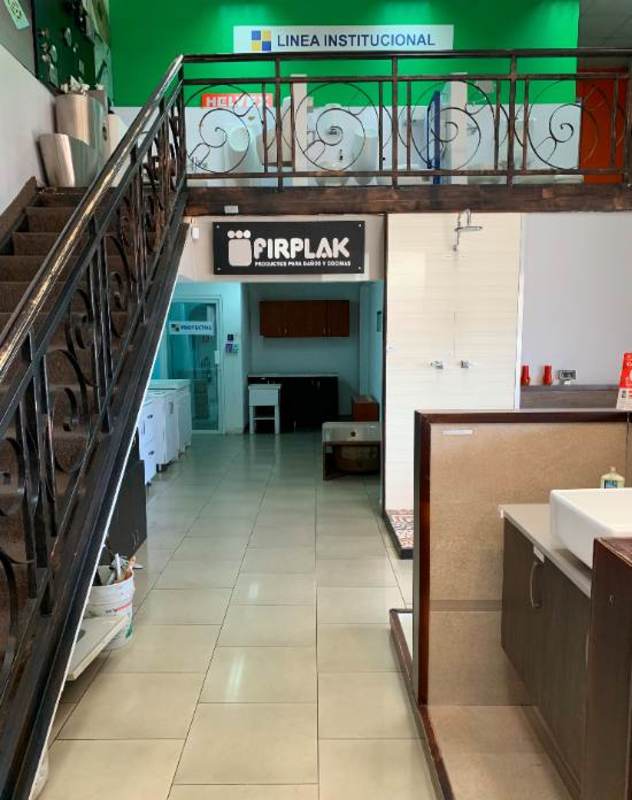 Interior retail showroom space with product displays and mezzanine in Parque Lefevre Panama