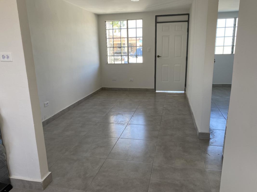 Compact kitchen with granite countertop, vintage backsplash and gas stove in corner rental Pacora