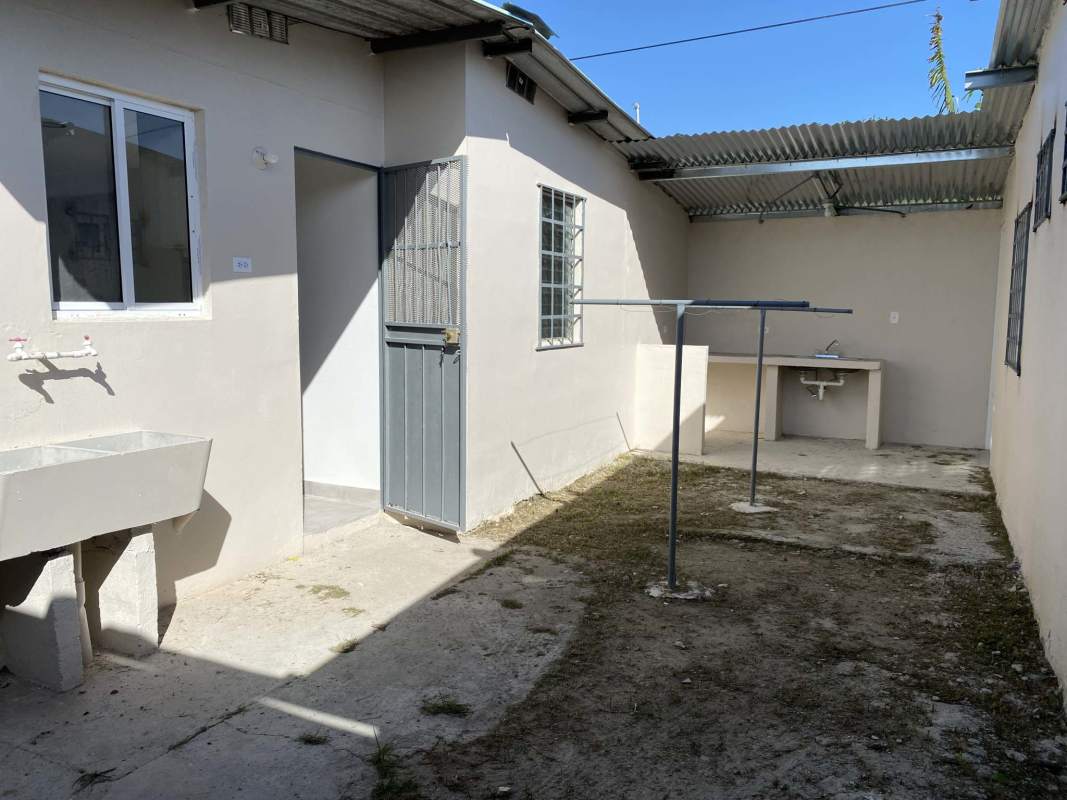Covered outdoor laundry sink and washing space in Pacora Panama rental house