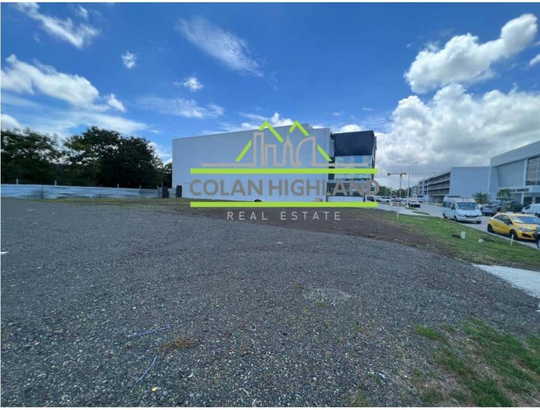 Empty corner parcel available inside Panama corporate park with paved roads