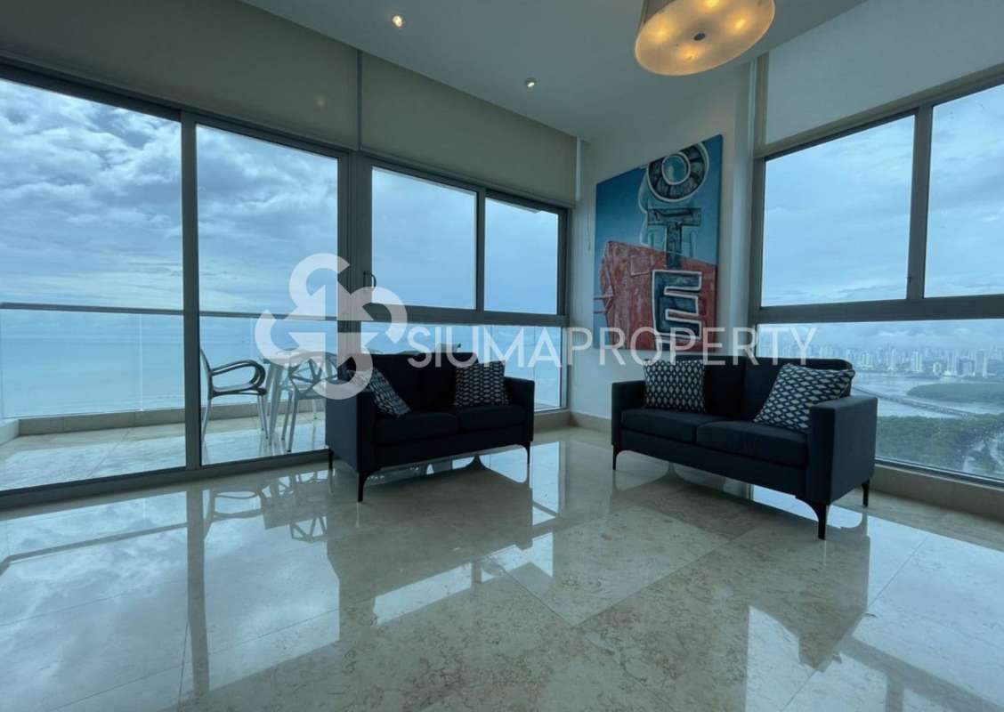 Luxurious apartment living room with large windows overlooking ocean Costa del Este Panama