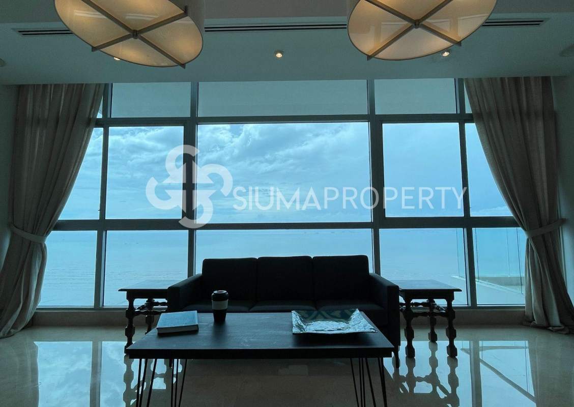 Floor-to-ceiling glass living area with ocean view in PH Costa del Este Tower Panama