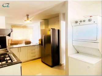 Kitchen with stainless appliances, granite counters, washer Senderos de Bambú Panama