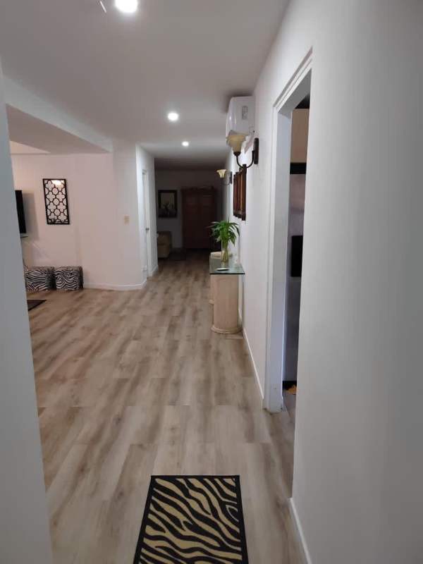 Large master bedroom with private balcony access at PH Clayton Tower Ciudad del Saber Panama