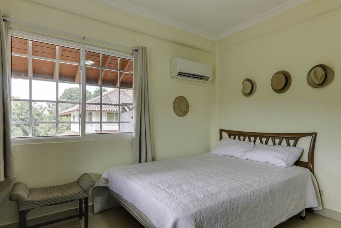 Spacious bedroom with AC, large window and neighborhood views in Albrook House Panama