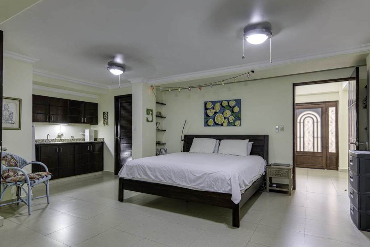 Spacious kitchen with granite countertops, wood cabinetry, large window Panama Albrook