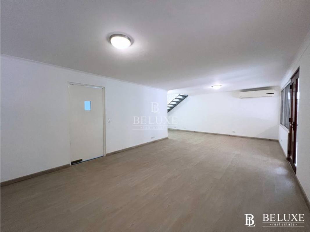 Bright living room with large glass windows and terrace garden views Punta Paitilla Panama