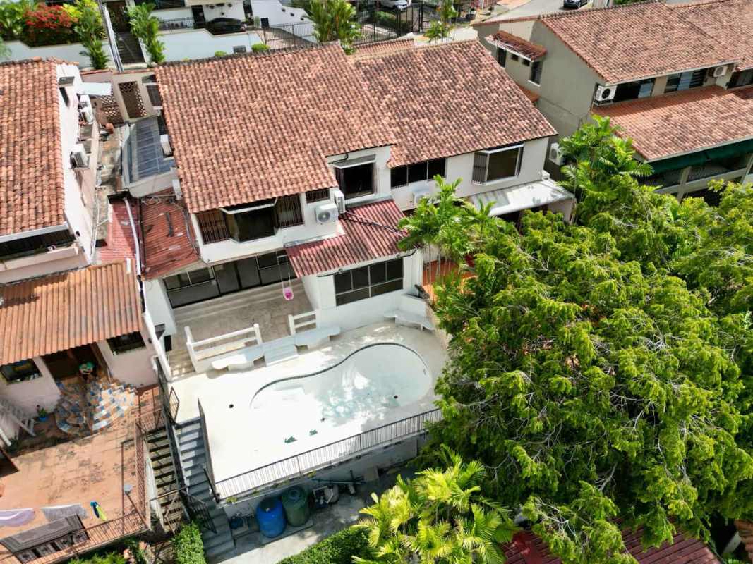 Aerial view Mediterranean townhouse with terracotta roof and private pool in Dos Mares Panama