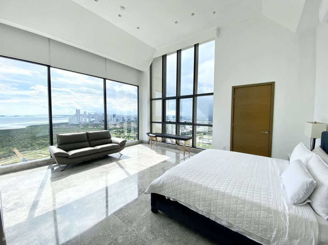 Elegant modern office with floor-to-ceiling glass boasting Panama skyline view at Empire Residences Santa Maria