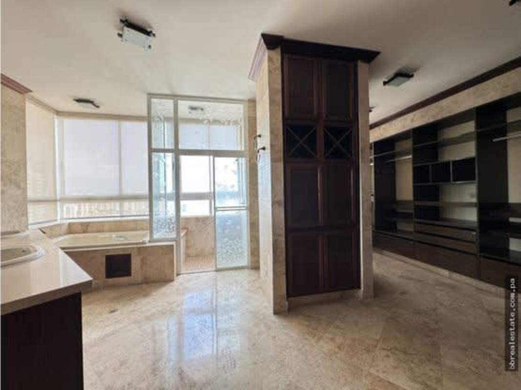 Traditional hallway with wood cabinets and glass shelving in PH Vista Park El Carmen Bella Vista Panama