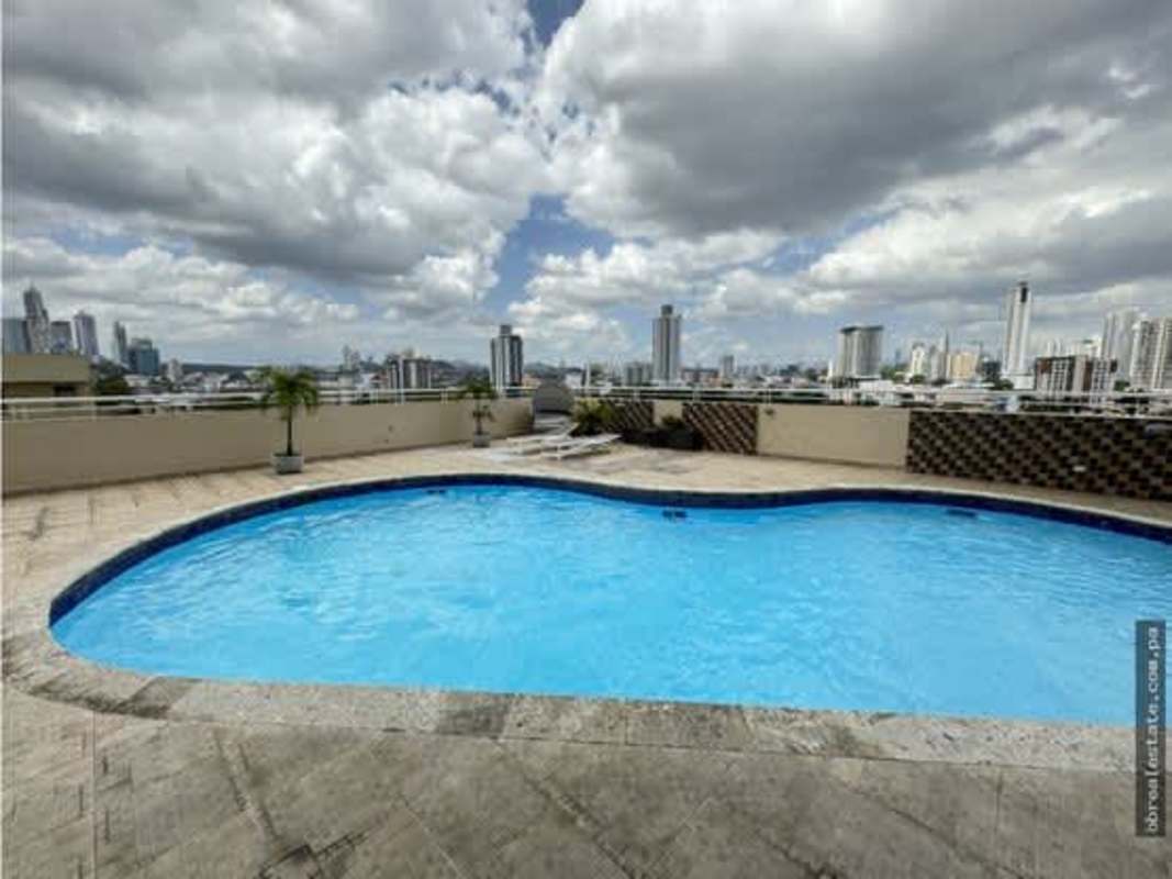Sunlit living room area with tiled floor and panoramic city views in PH Vista Park El Carmen Panama