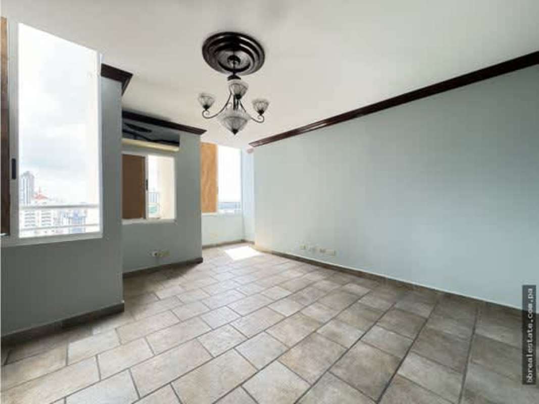 Modern empty living room with tiled flooring and ample natural light PH Vista Park Panama City