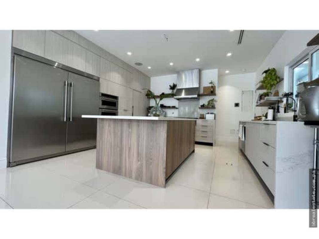 Contemporary kitchen with island, quartz counters, stainless appliances in PH Sunset Coast Panama