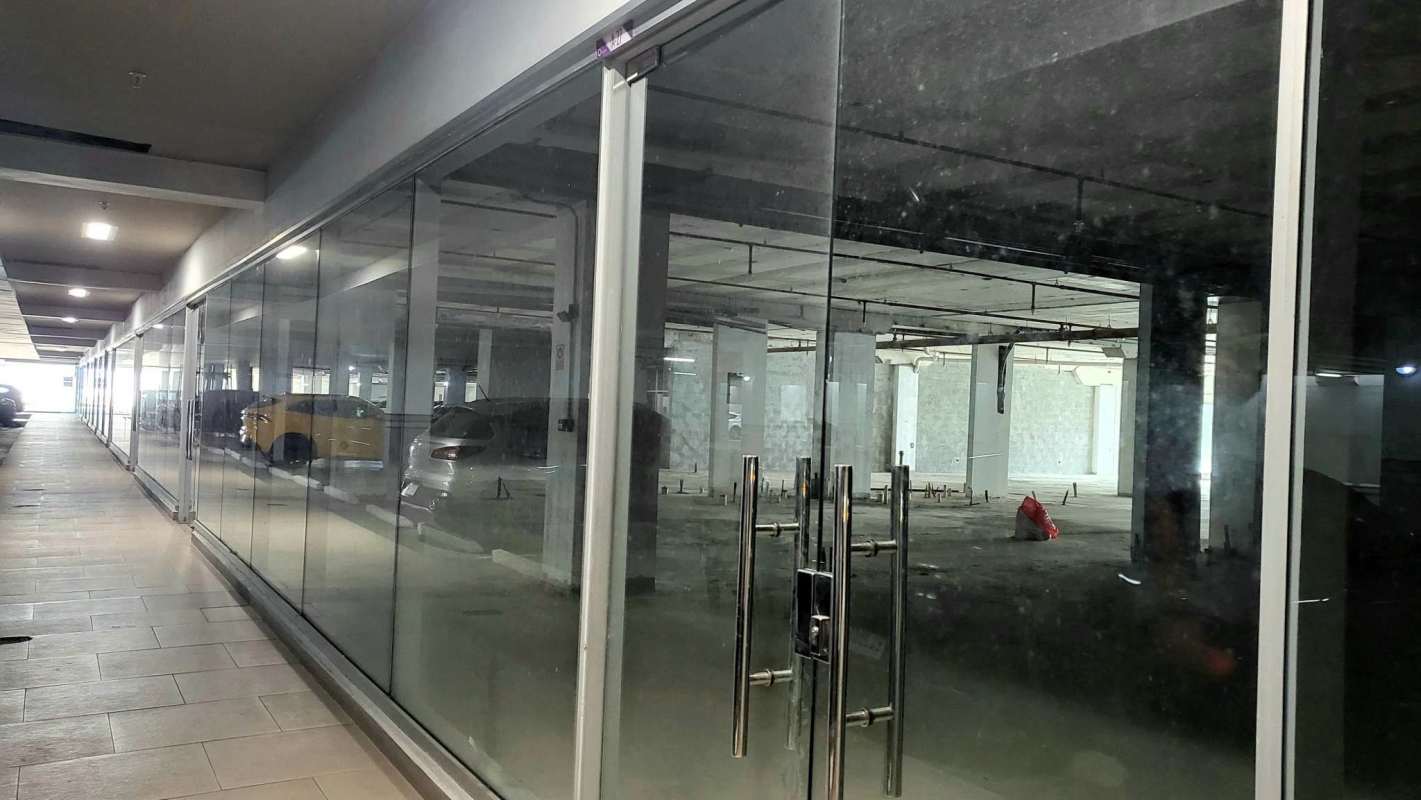 Three-story modern glass facade office and retail complex Terrazas de Albrook in Panama City