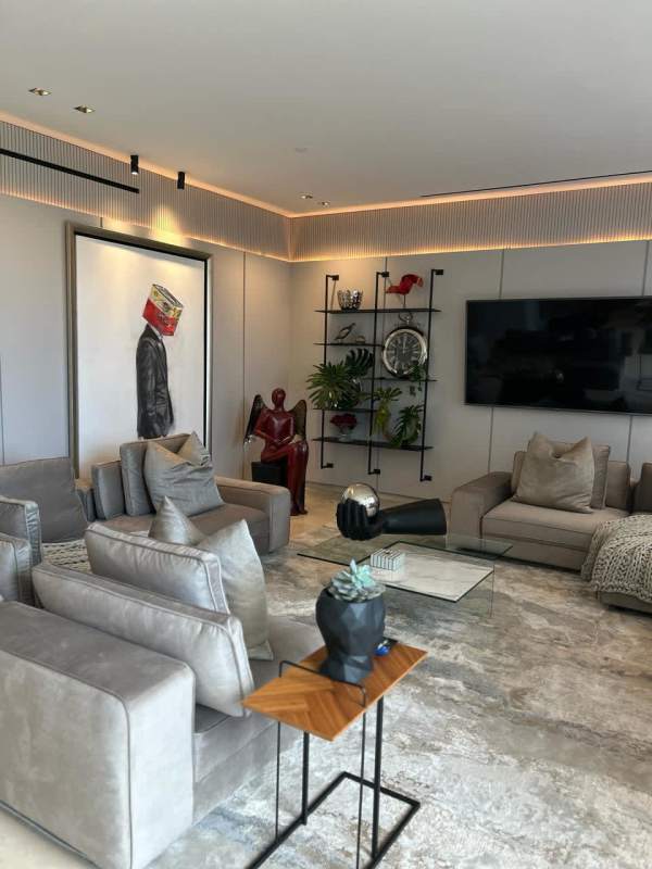 Luxury bedroom with gray upholstered bed, modern decor, luxury condo Santa Maria Panama