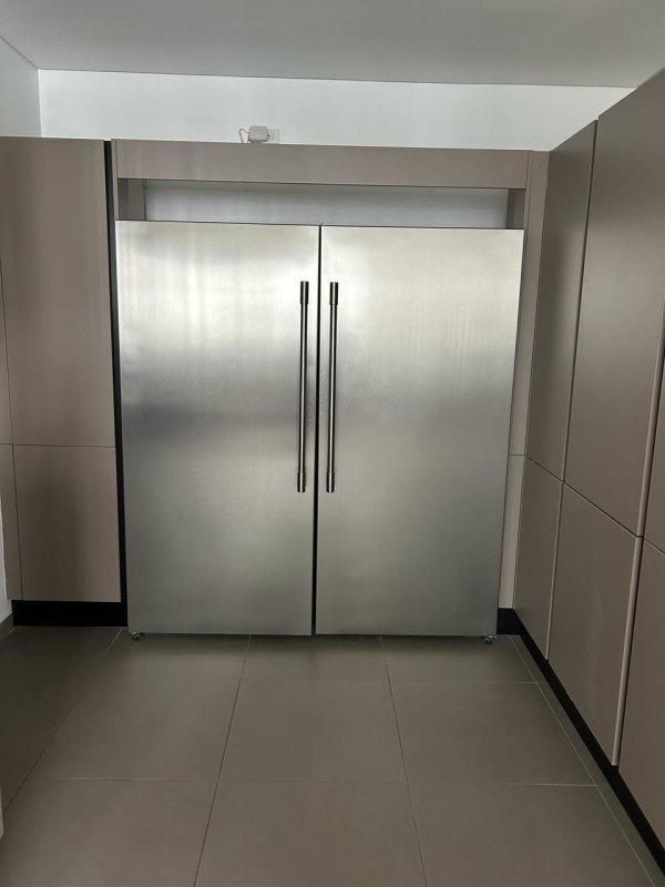 Floating black vanity, round mirror, wall-hung toilet modern bathroom in Santa Maria Panama