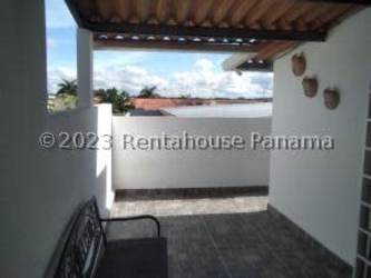 Tiled porch and side terrace area with seating in La Chorrera Panama Oeste