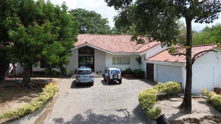 Front exterior Mediterranean house villa with large driveway in Coronado Golf Panama