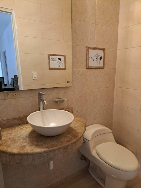 Bright bedroom with ceiling fan, AC, large windows and green garden view in Albrook Panama