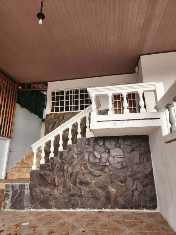 Spacious bedroom with ceiling fan, tiled floor and built-in wardrobe in Los Harinos Hato Pintado Panama City