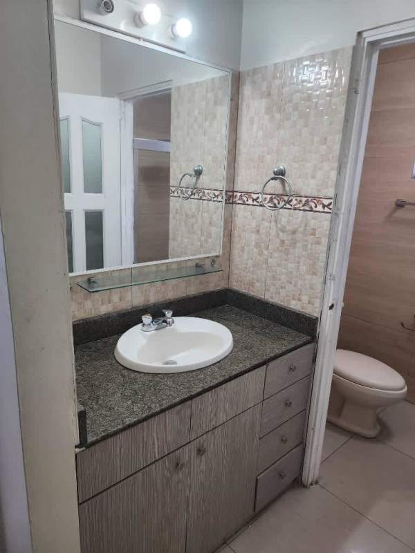 Bathroom with granite countertop and large mirror in Los Harinos updated home Hato Pintado Panama