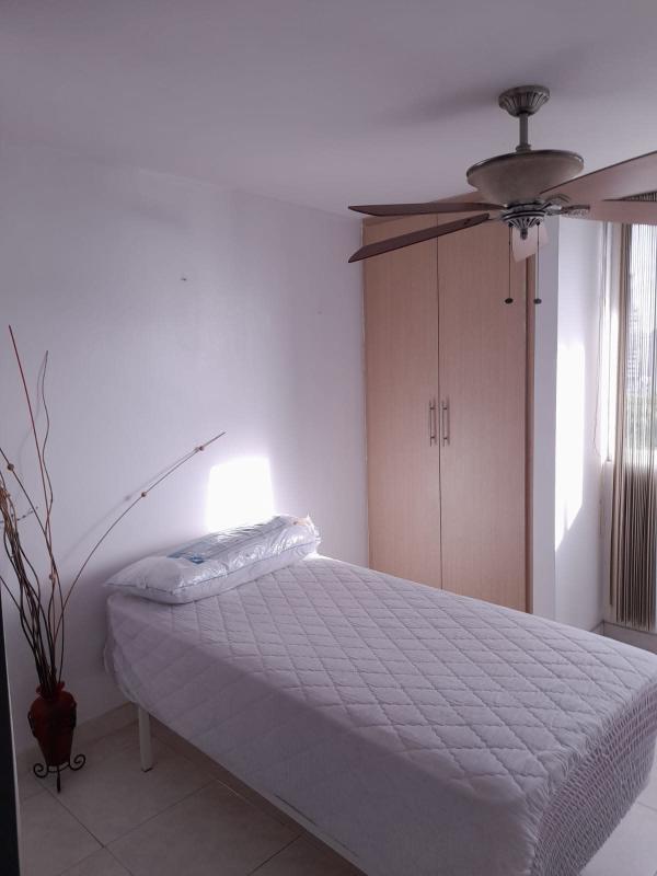 Furnished living room with glass dining table colorful curtains PH Plaza Edison Panama