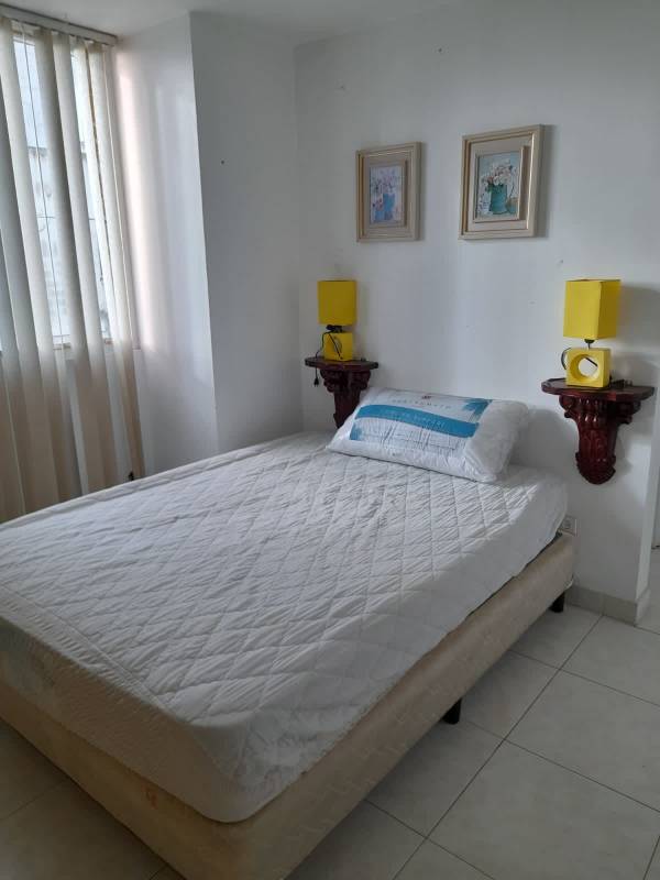 Minimalist bedroom with wardrobe and vertical blinds PH Plaza Edison Panama City