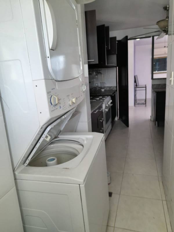 Modern kitchen with granite stacked washer dryer PH Plaza Edison Panama
