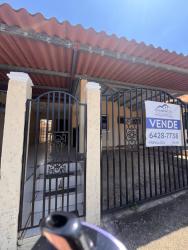 Front secure gate and porch of house for sale in Brisas de Arraiján Panama