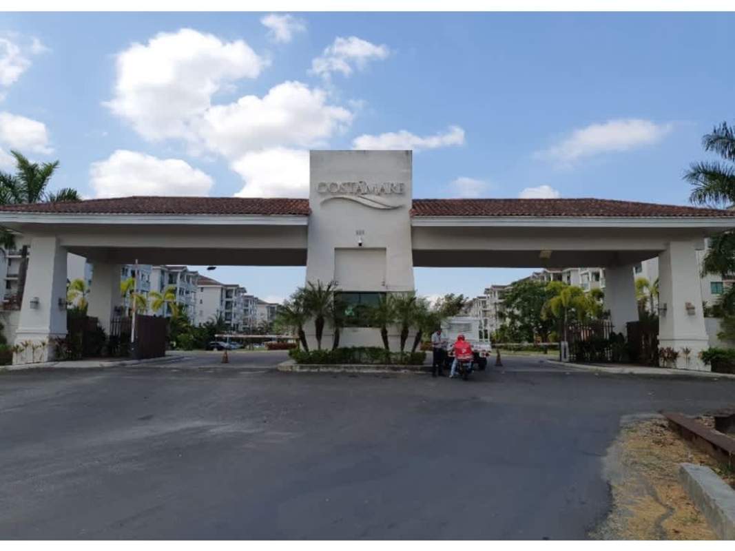 Mediterranean-inspired gated entrance of PH Costa Mare with tile roof, palm trees and security post in Costa del Este Panama