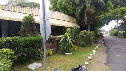 Single-story house with striped awnings in Penonomé center near shops Panama for sale