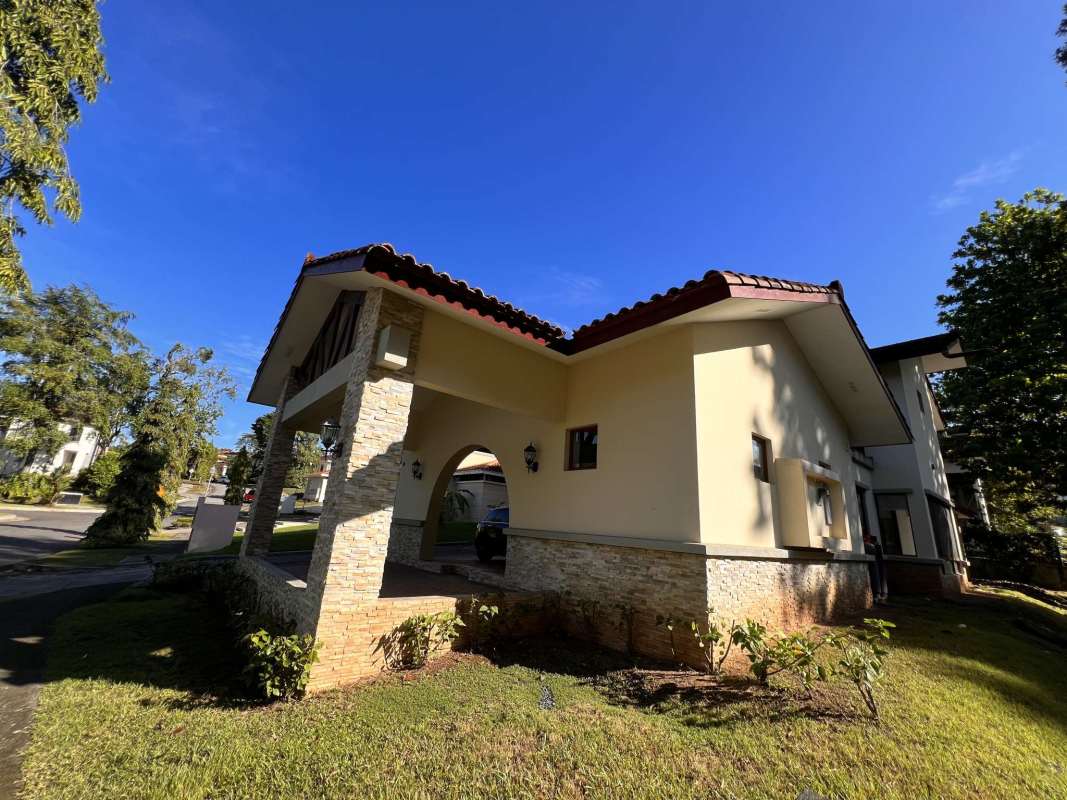 Entry porch with stone accents, landscaped garden, and Mediterranean details Senderos de Cruces Clayton Panama