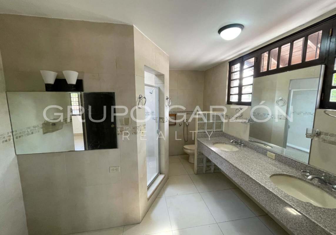 Living room with wood ceiling tile floors colonial architecture Altos del Golf Panama City