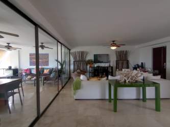 Granite kitchen with stainless appliances and marble floors at oceanfront condo Punta Barco