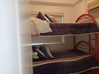 Spacious master bedroom with ensuite bathroom and ocean view at Punta Barco Resort Panama