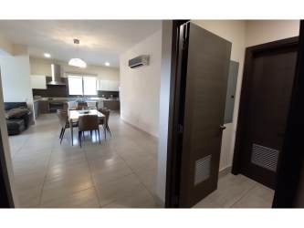 Spacious living and dining room with natural light balcony access River Valley Panama Pacifico