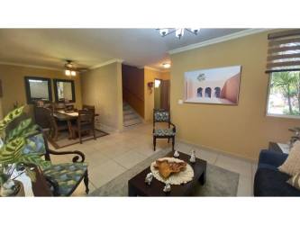 Closed kitchen with granite countertops, modern cabinets, oven, and stove