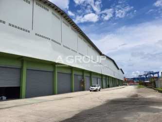 Large warehouse building exterior roll-up doors ventilation blocks in Colon Free Zone Panama