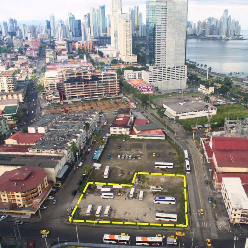 Aerial of Panama with metro station, commercial area, empty plot outlined in yellow ready for development