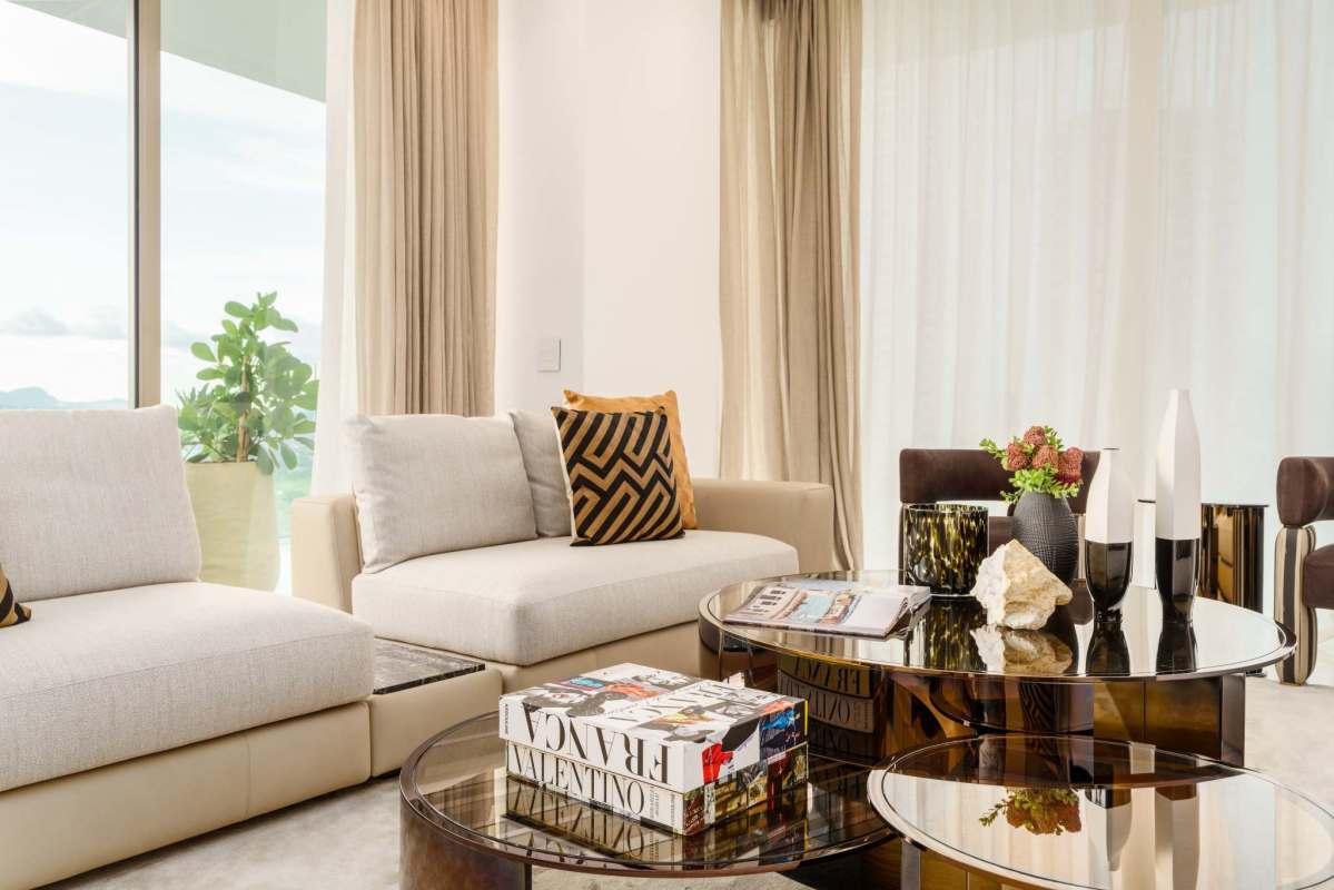Stylish open living with floor-to-ceiling windows in La Maison by Fendi Casa Santa Maria Panama