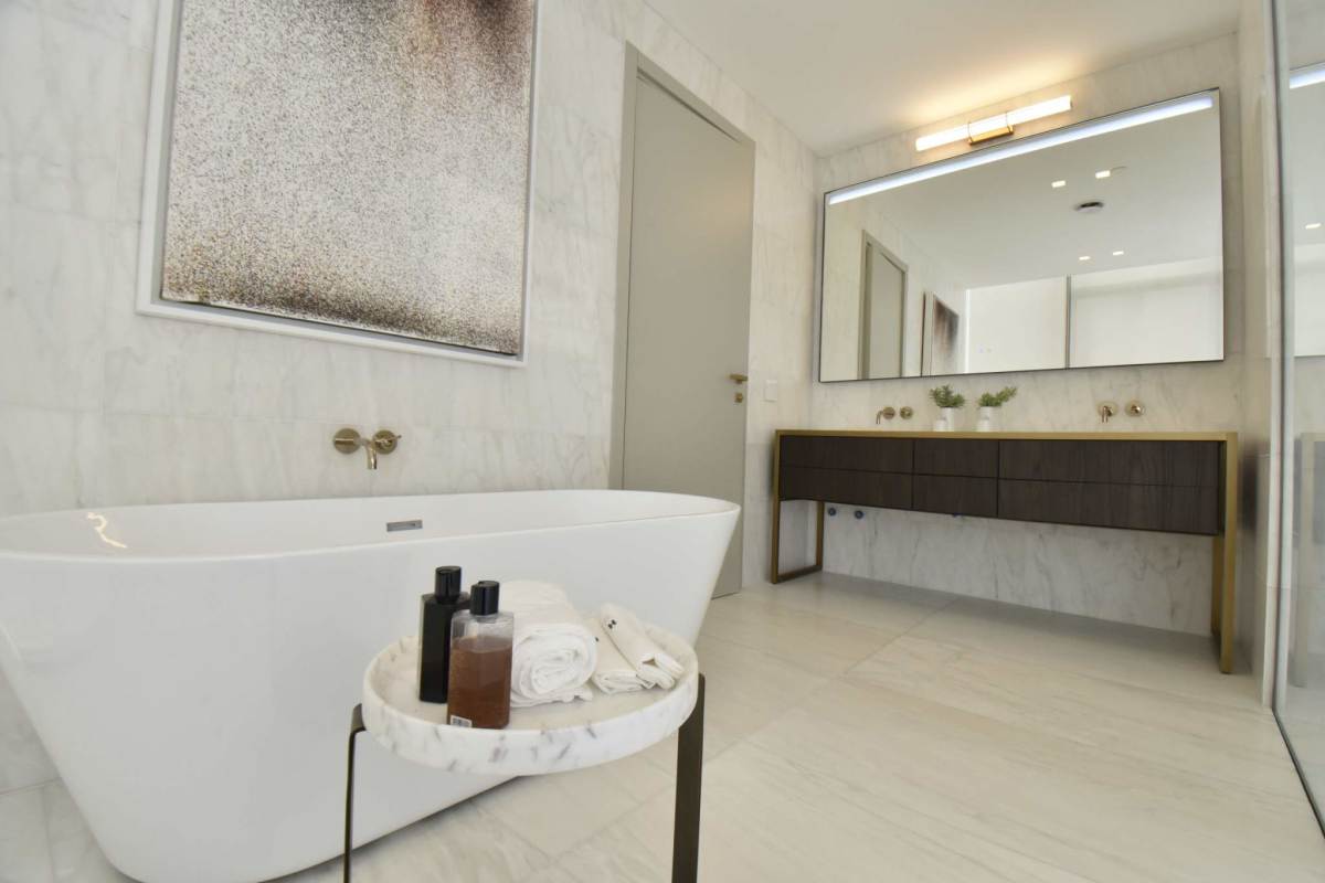 Modern bathroom with marble finishes double sink vanity upscale condo La Maison Fendi Panama