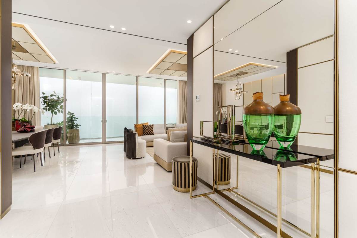 Large modern living dining space marble floors floor-to-ceiling windows luxury condo in Santa Maria Panama