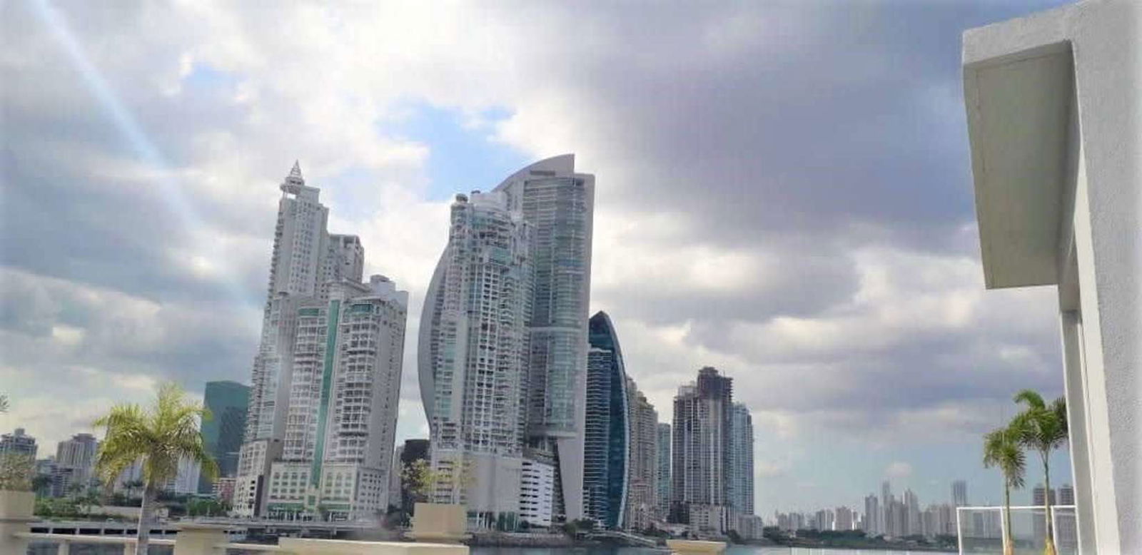 Spacious master bedroom with panoramic marina and city views at PH Montecarlo Ocean Reef Islands Panama