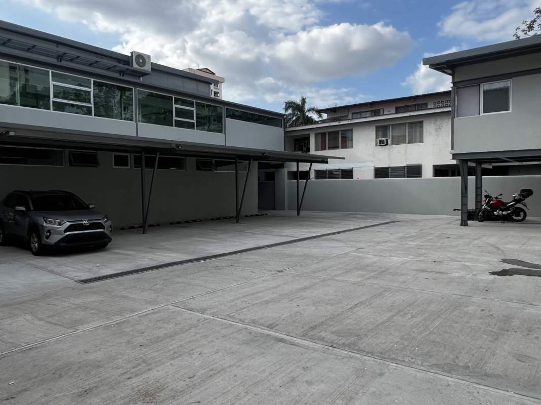 Reserved covered parking spaces with modern facade at Plaza Level 37 San Francisco Panama