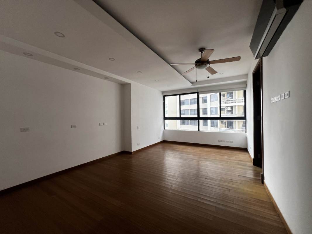 Master bedroom with panoramic ocean views, hardwood floor, floor-to-ceiling windows