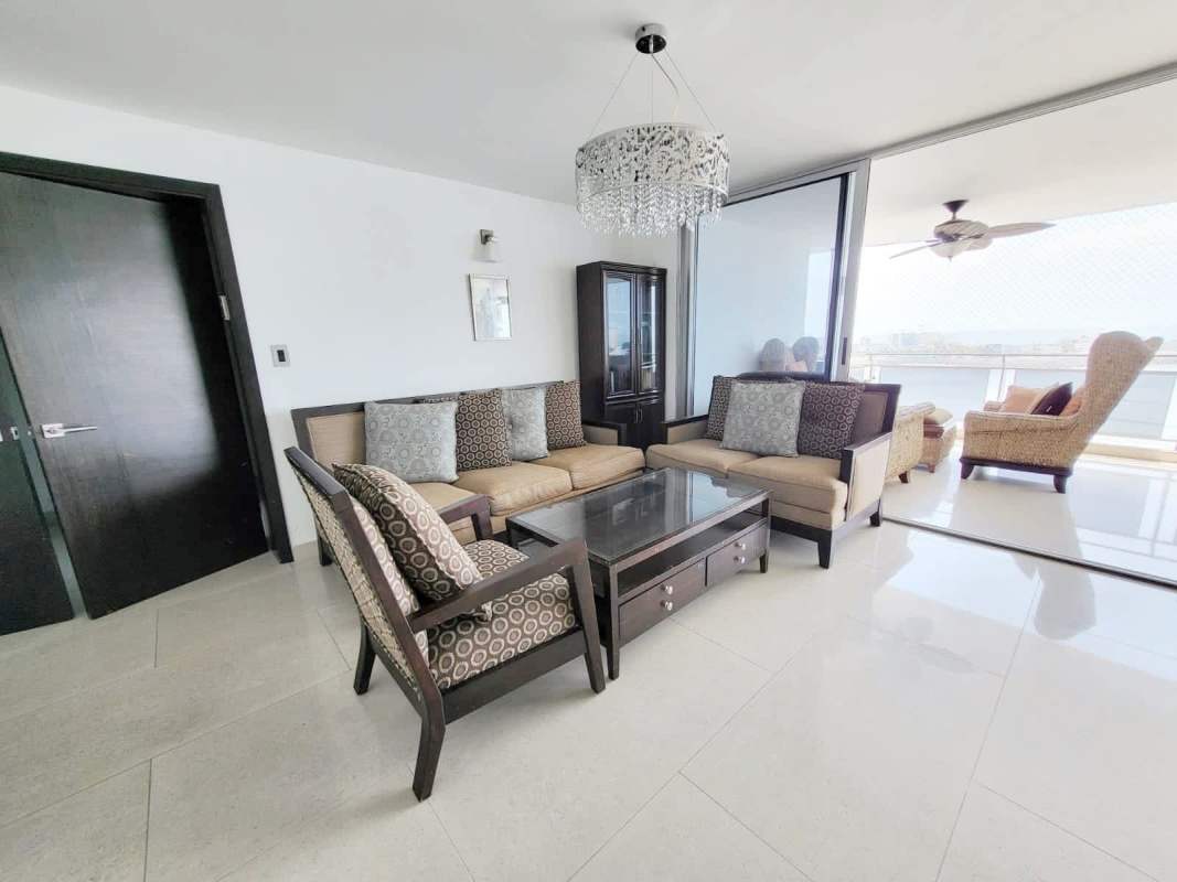Dining area with crystal chandelier and panoramic windows Punta Paitilla Panama