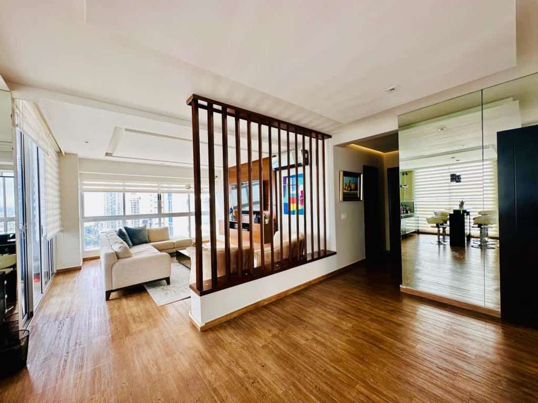 Spacious living dining area with large windows, marble floors in Vision Tower Coco del Mar Panama