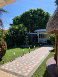 Covered outdoor dining terrace and cocktail bar at Casa Amarilla hotel Punta Chame Panama