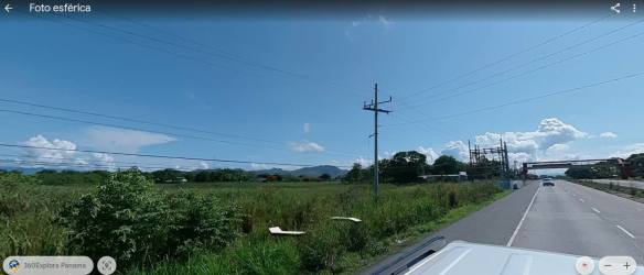 Grassy field roadside with mountains backdrop along Panamerican Highway Rio Grande Panama