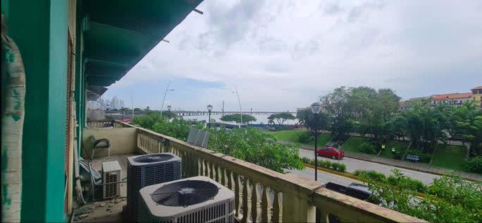 Scenic balcony in colonial building overlooking bay, bridge and historic center Panama City